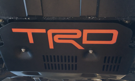 Placa protectora TRD con letras de plástico NARANJA en relieve